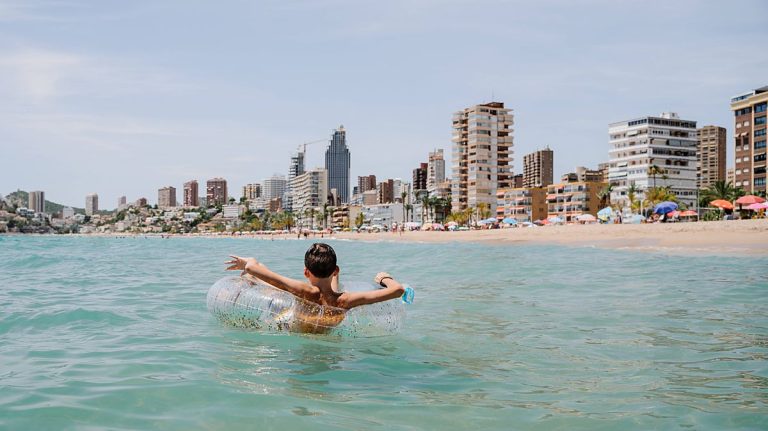 0 rear view of happy caucasian kid enjoying relaxing bath with a float or inner tube in summertime i.jpeg 0 rear view of happy caucasian kid enjoying relaxing bath with a float or inner tube in summertime i.jpeg