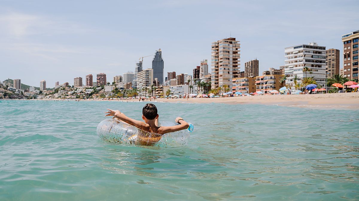 1 rear view of happy caucasian kid enjoying relaxing bath with a float or inner tube in summertime i.jpeg 1 rear view of happy caucasian kid enjoying relaxing bath with a float or inner tube in summertime i.jpeg