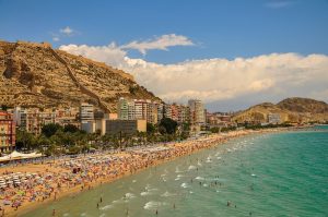 spanish beach crowded with visitors and expats.jpg